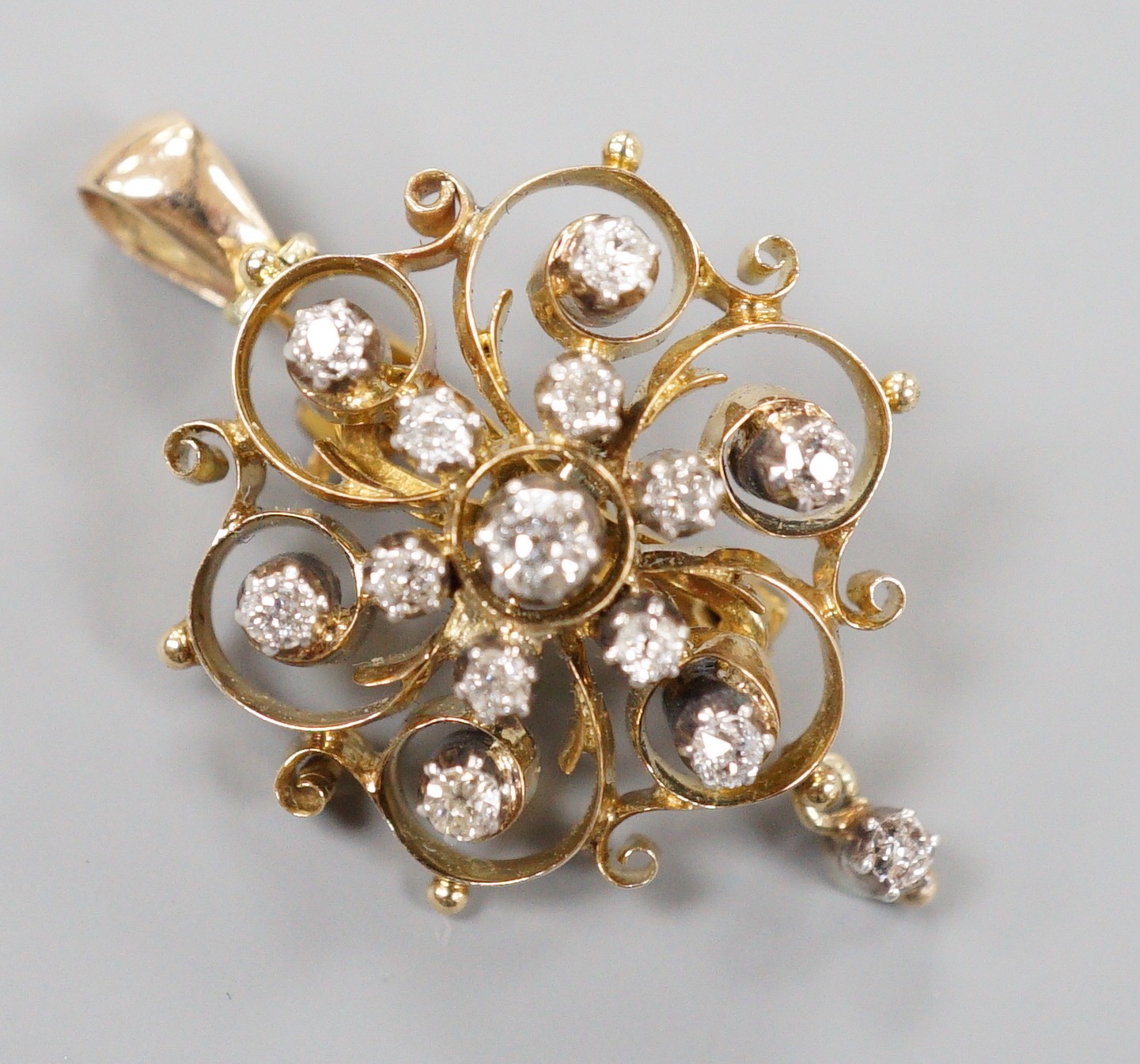 An Edwardian pierced 15ct and diamond cluster set drop pendant brooch, 24mm, gross weight 6.1 grams.
